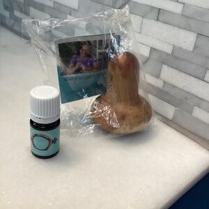 Young Living One Heart oil .17 fl oz, and olive wood massage tool